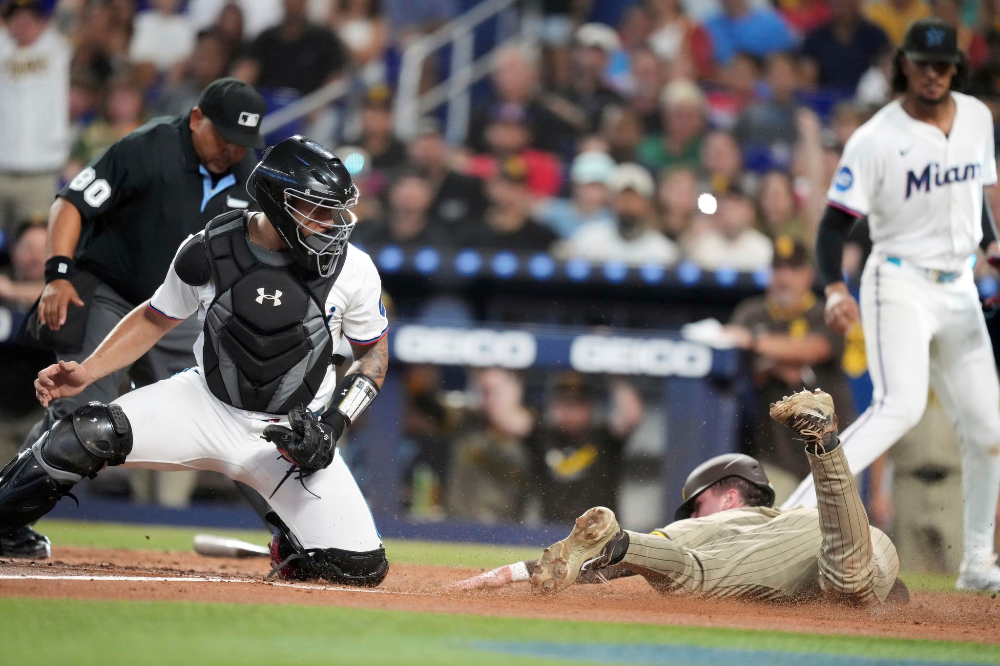 Merrill, Maldonado deliver RBI hits in the 2nd inning as Padres hold on to beat Marlins 2-1