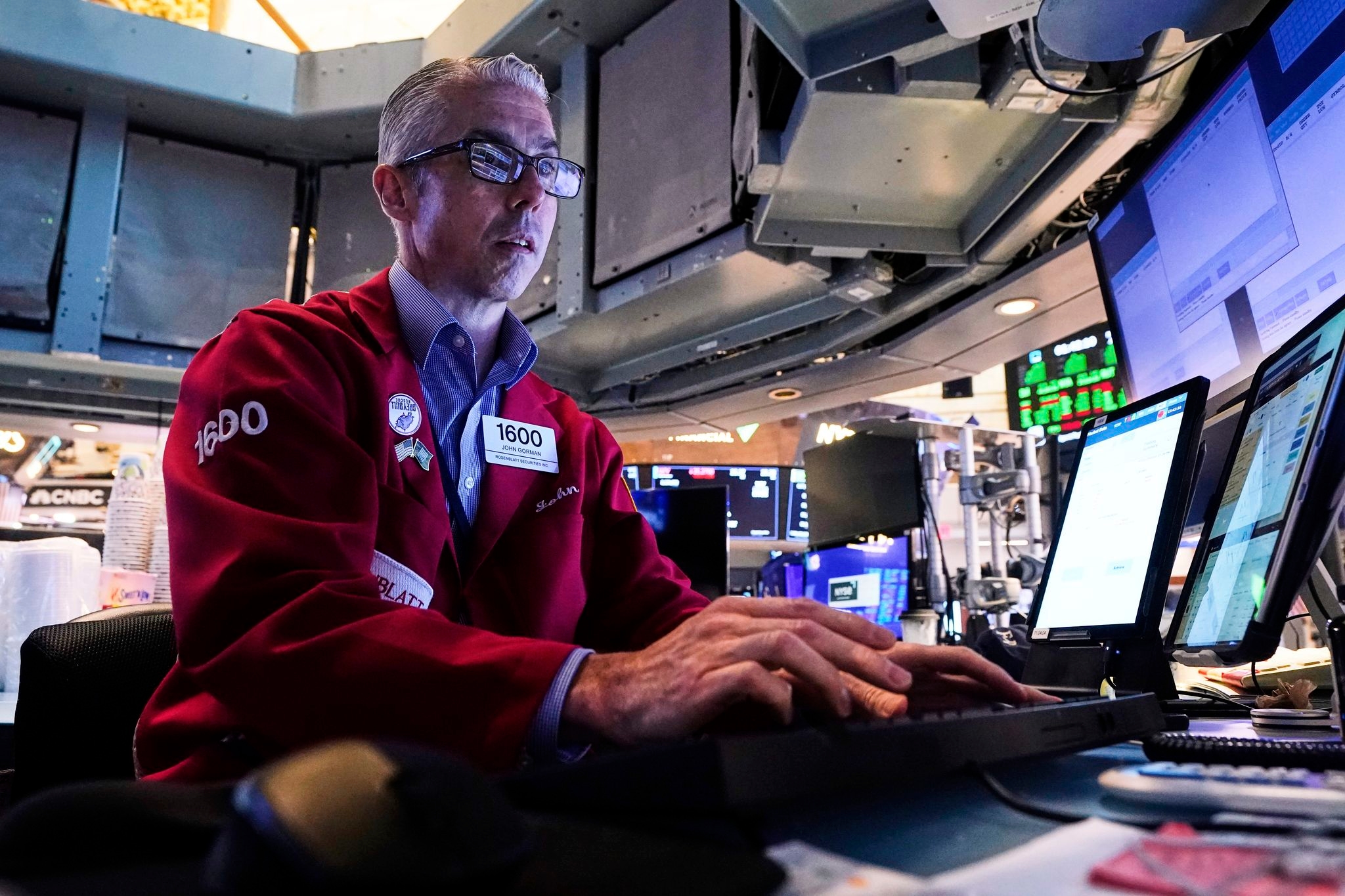 Tesla tumbles and Alphabet rallies to keep Wall Street near its records