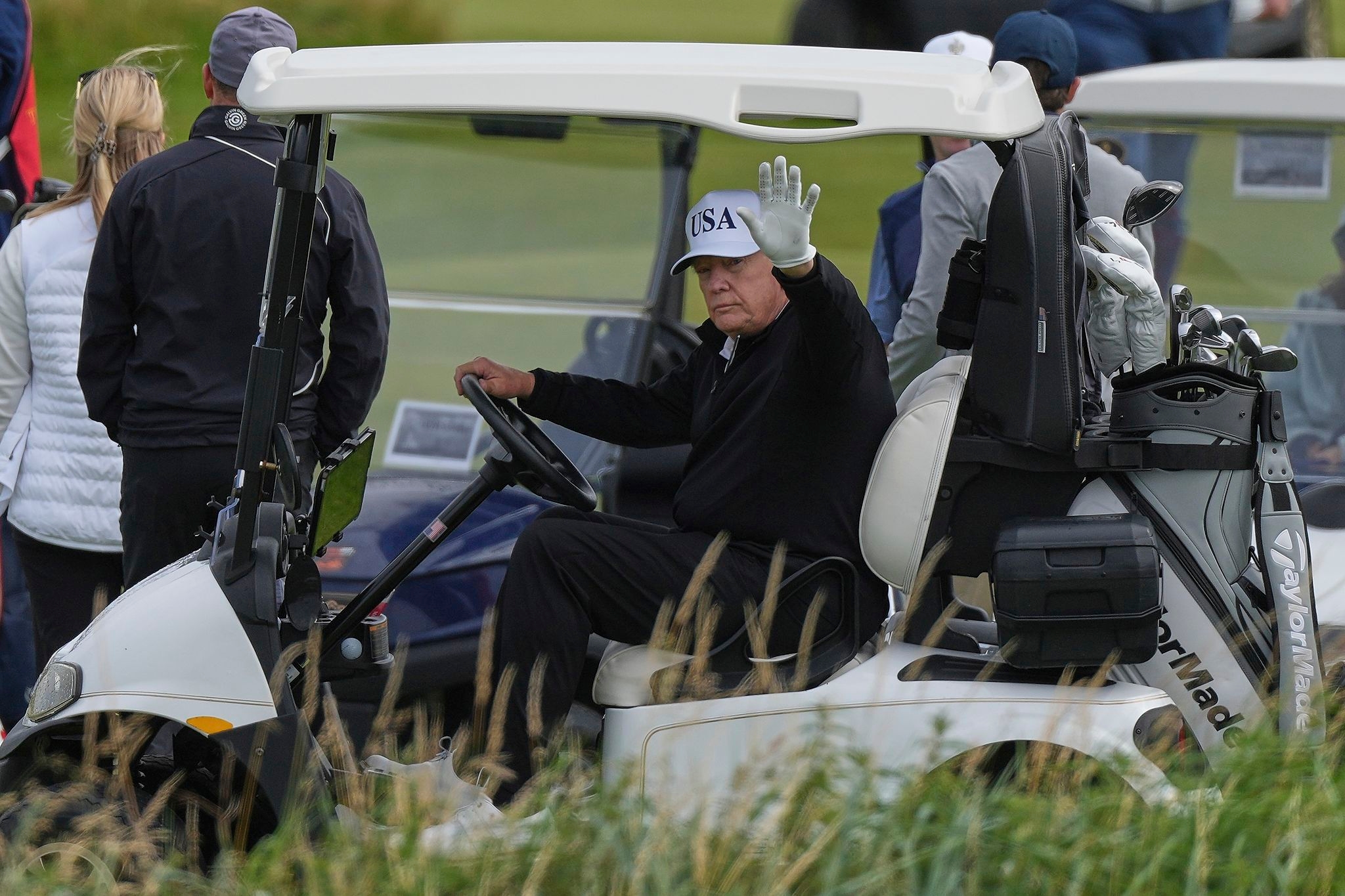 Trump plays golf in Scotland while protesters take to the streets and decry his visit