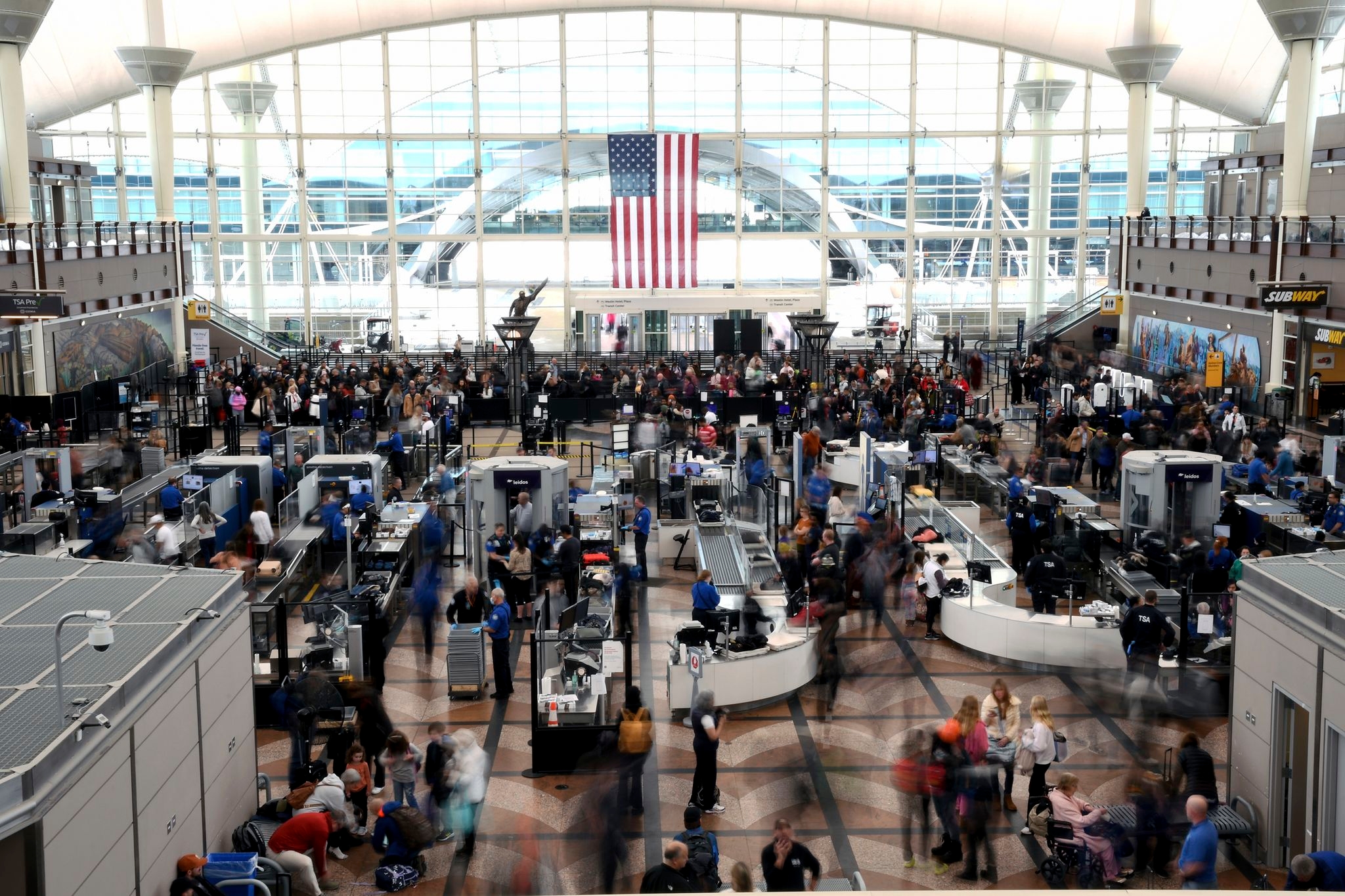 Passengers flee smoking jet on emergency slide after apparent landing gear problem at Denver airport