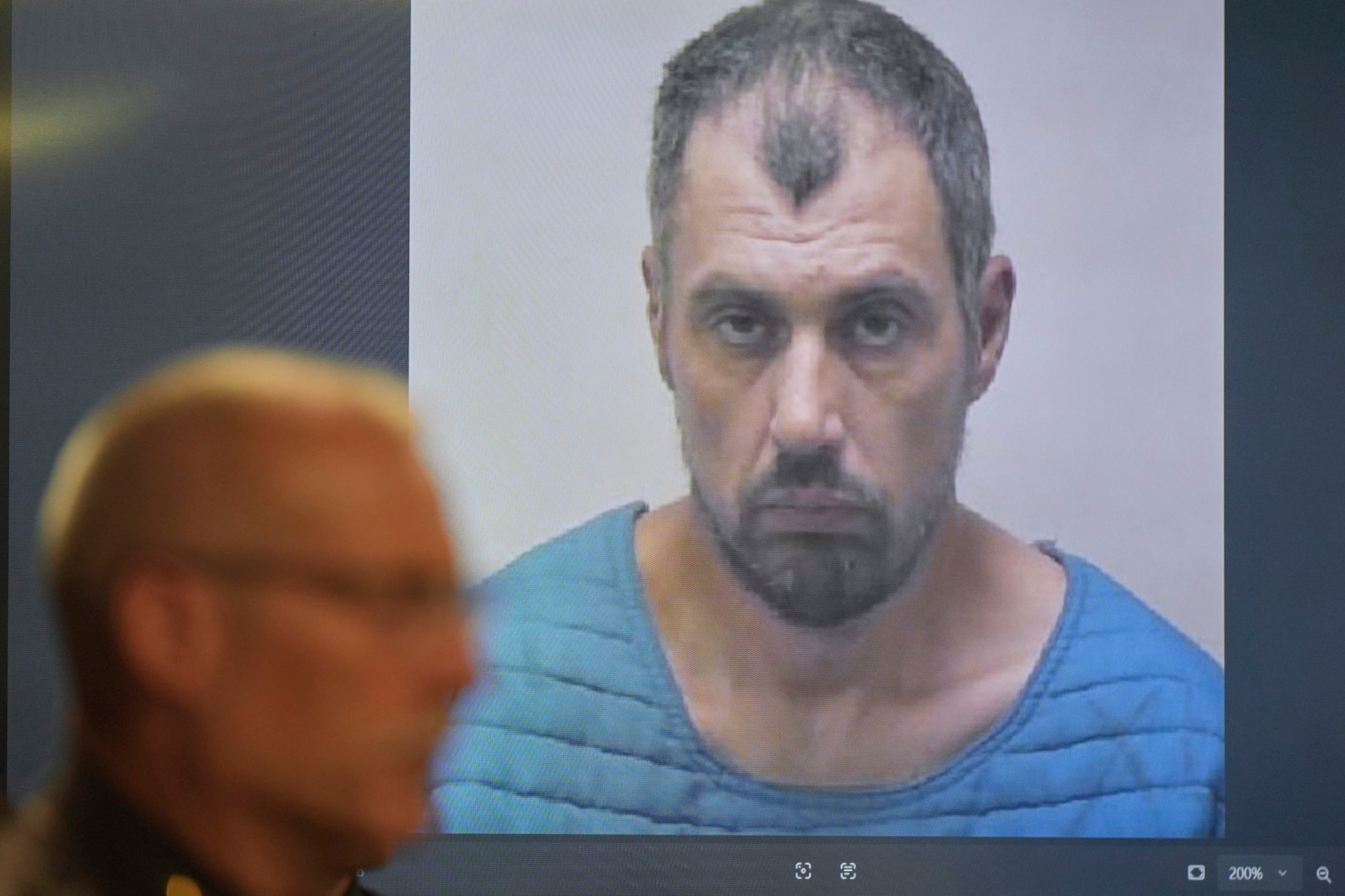 Suspect in Michigan Walmart stabbings is charged with a rarely used state terrorism count