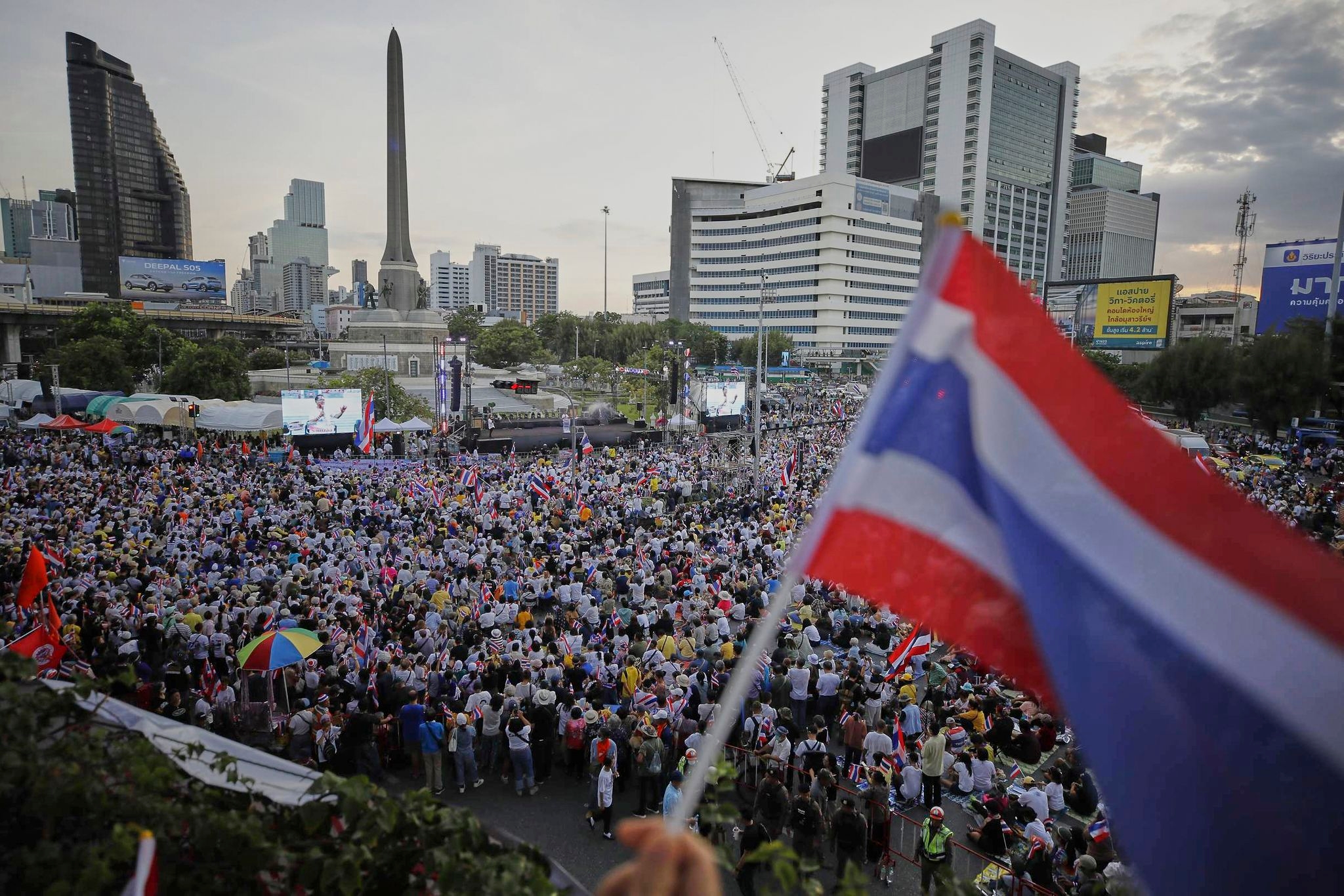Protesters in Bangkok demand resignation of court-suspended prime minister following deadly conflict