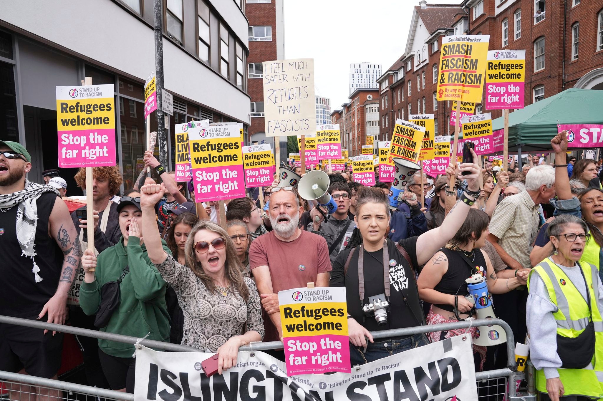 Rival anti-migrant and anti-racism protests face off outside a hotel housing migrants in London