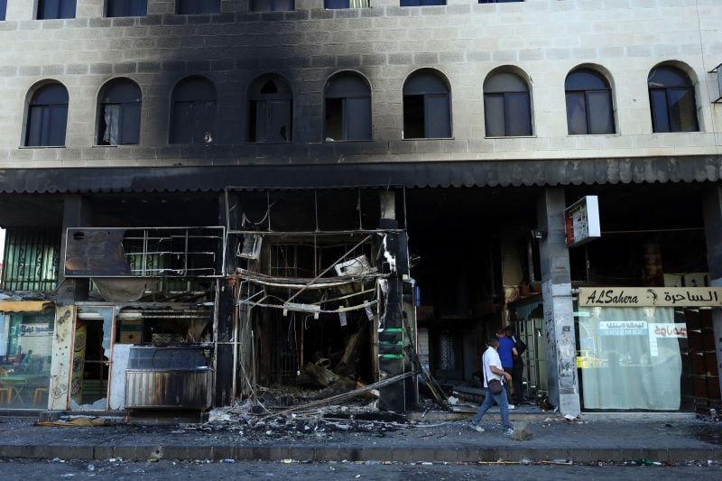 Troops quit Druze heartland leaving bodies on streets
