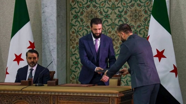 Syria&#039;s president signs temporary constitution amid ongoing conflict