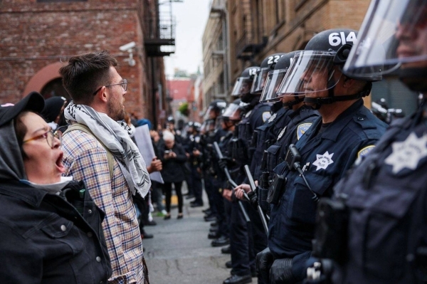 Police arrest about 60 people in San Francisco after protests on ICE&#039;s raids turn violent