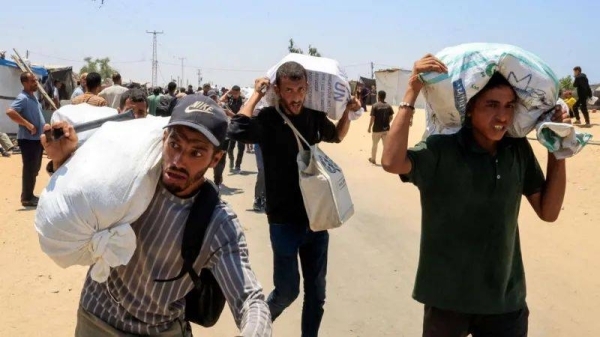 Palestinians say local gunmen and Israeli forces opened fire near Gaza aid site