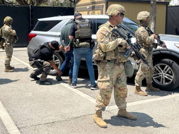 LA police enforce curfew as Trump vows to &#039;liberate&#039; city