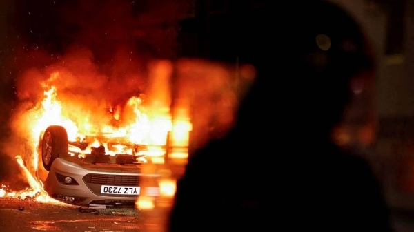 Masked rioters in Northern Ireland attack police, torch houses for second night