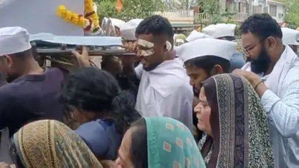Lone Air India survivor carries coffin of brother killed in crash