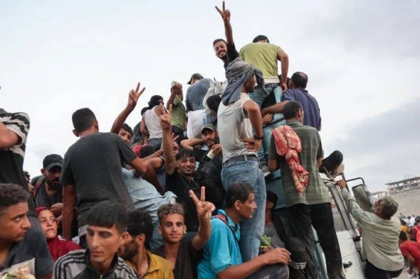 At least 20 Palestinians killed after aid trucks overturn in central Gaza