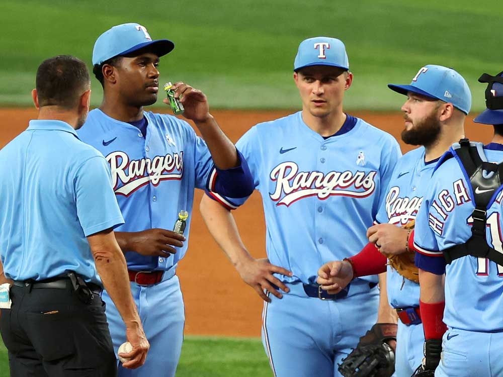Texas Rangers rookie Kumar Rocker chugs pickle juice and gets himself out of a pickle