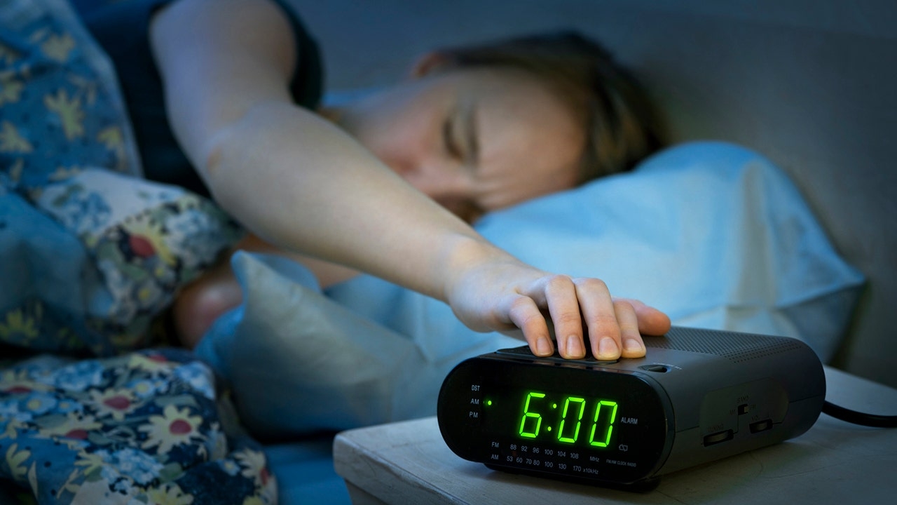 Most Americans hit the snooze button every morning — here's why it could be bad for your health