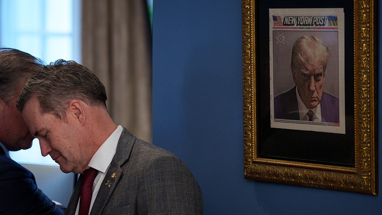 Trump's mugshot spotted hanging in ornate frame near Oval Office