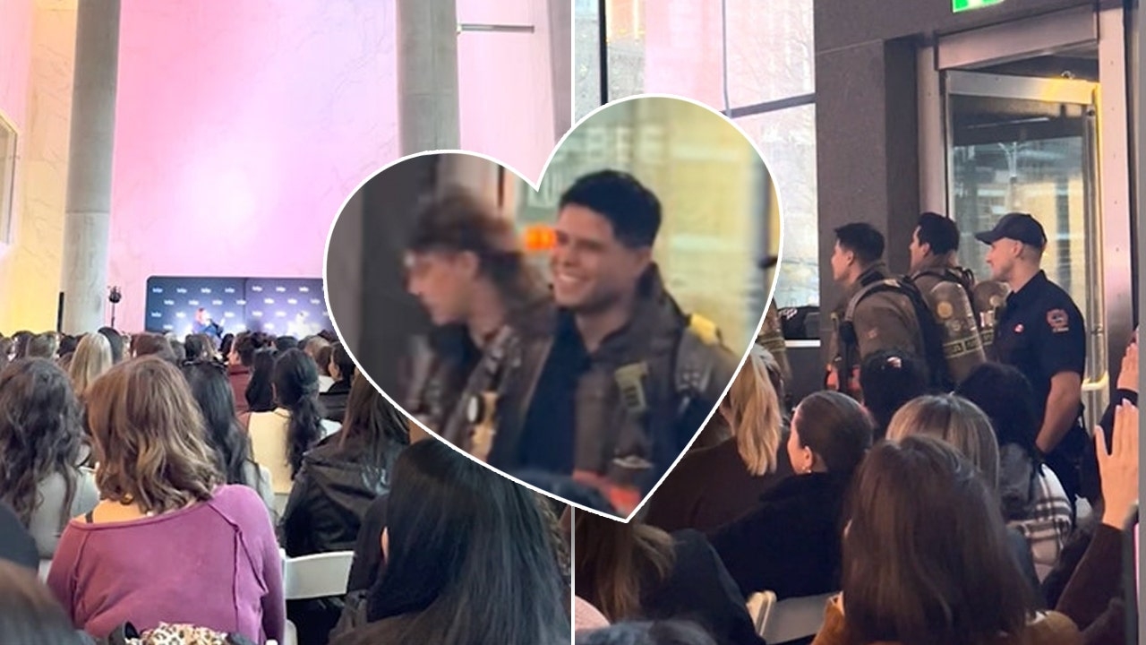 False alarm, real heat: Firefighters surprise crowd of romance novel fans