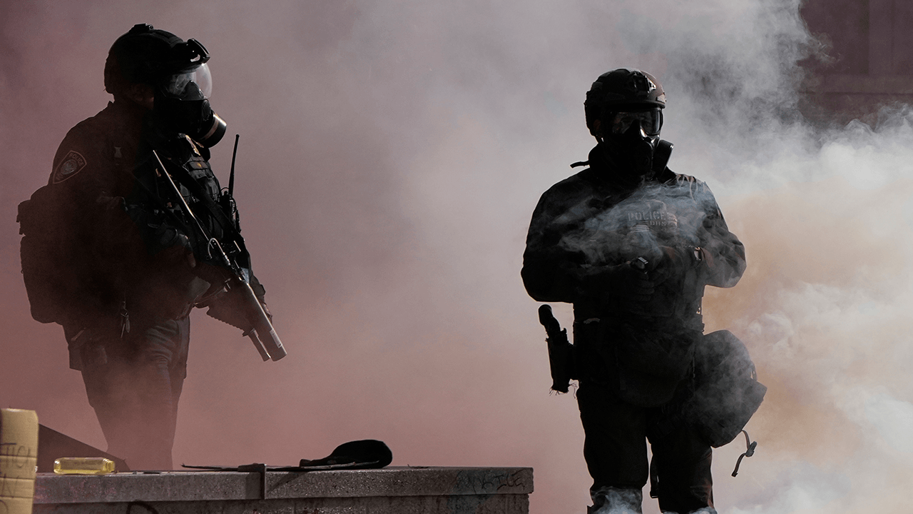 Officers injured as Portland rioters breach ICE building with explosives and rocks