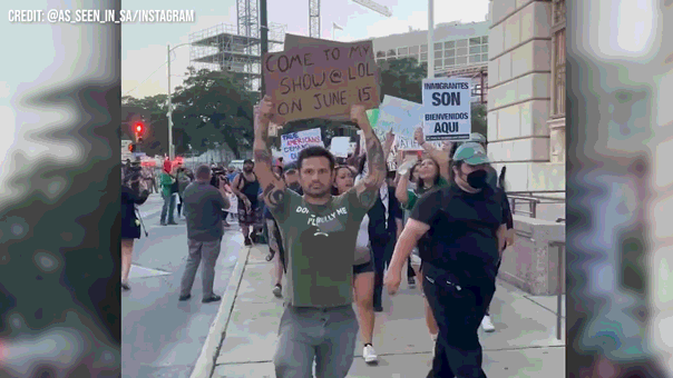 Marine veteran disrupts immigration protests with comedy sign, sparks liberal fury