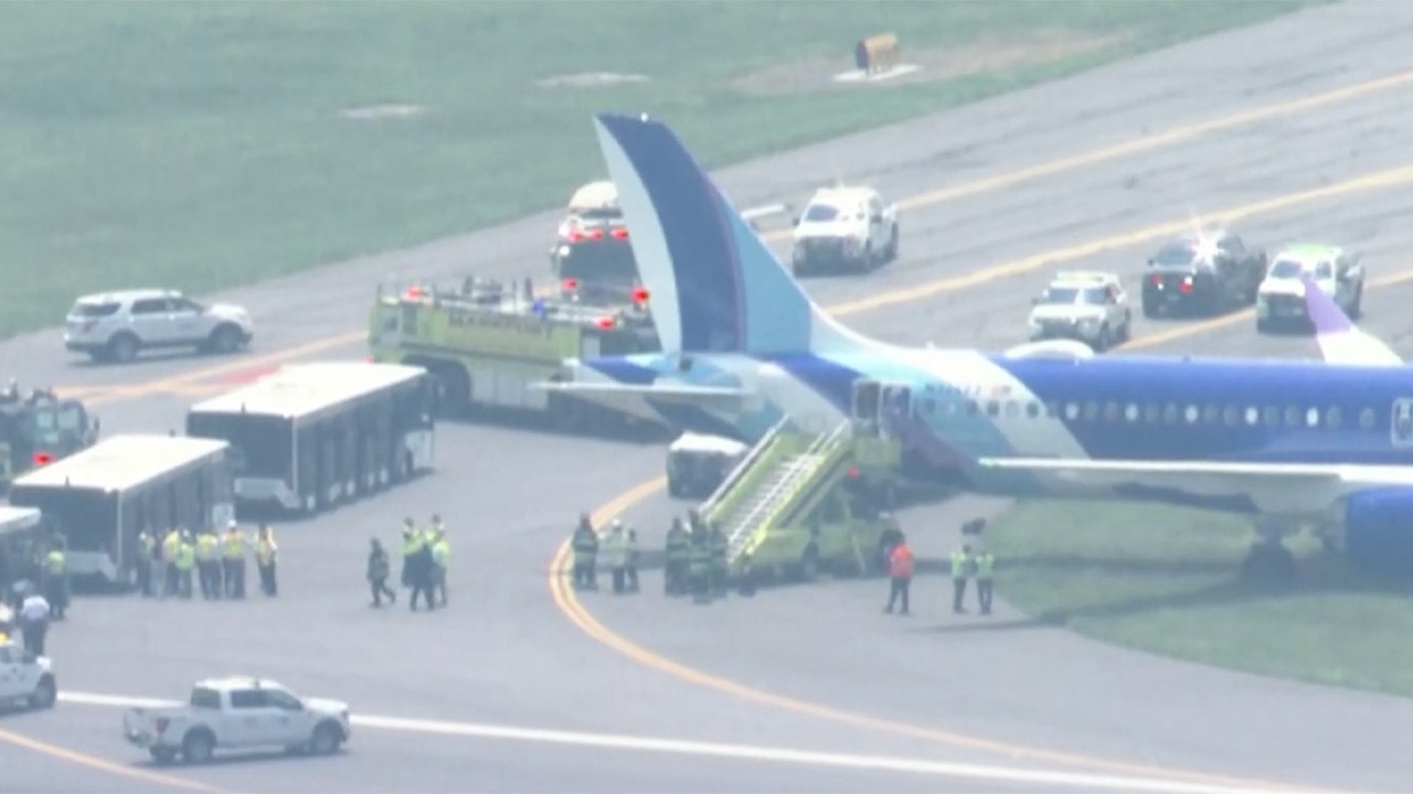 JetBlue aircraft rolls off runway while landing at Boston's Logan Airport