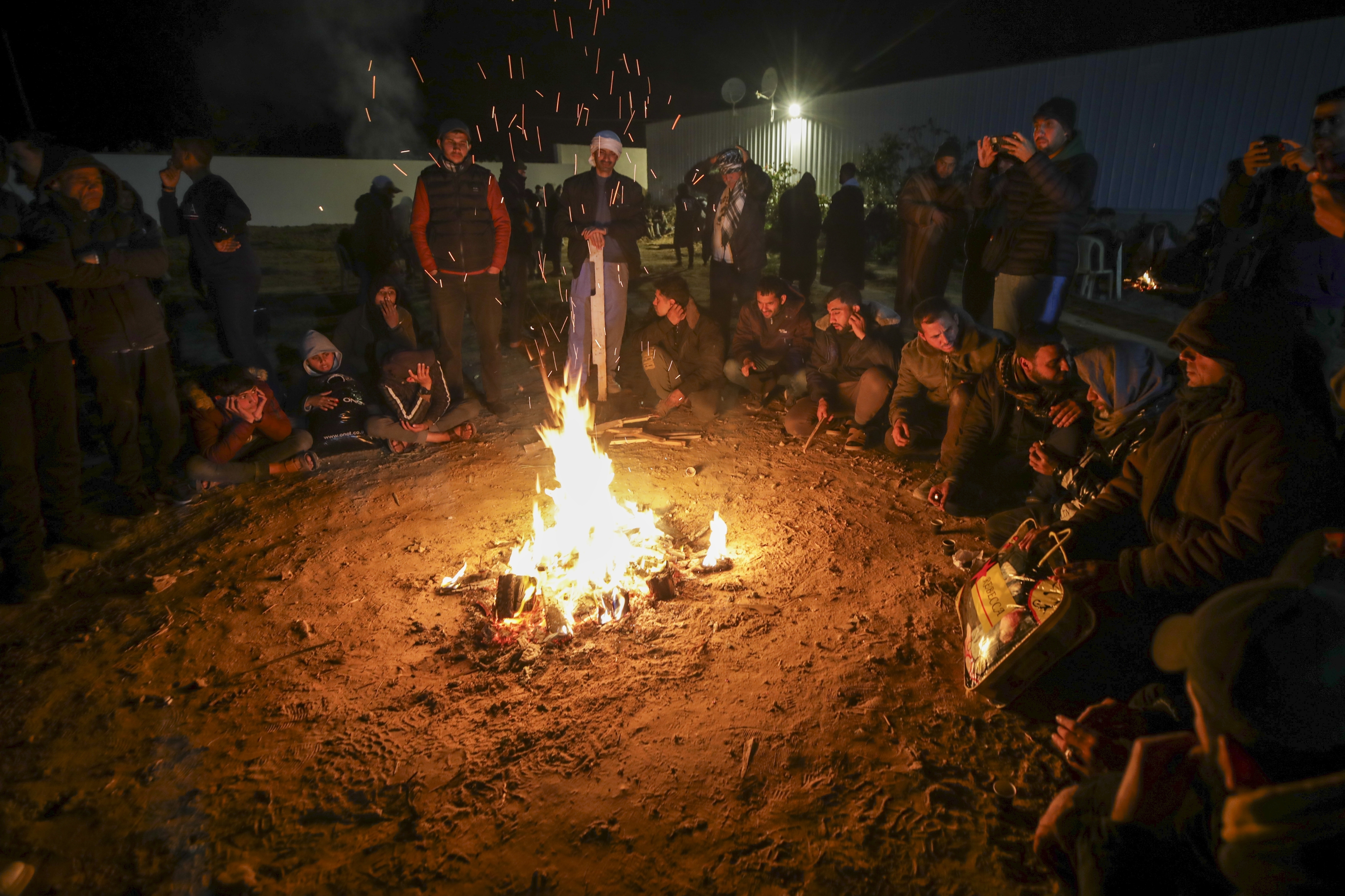 Hamas hands over bodies of 4 hostages to Israel as dozens of Palestinians leave prison