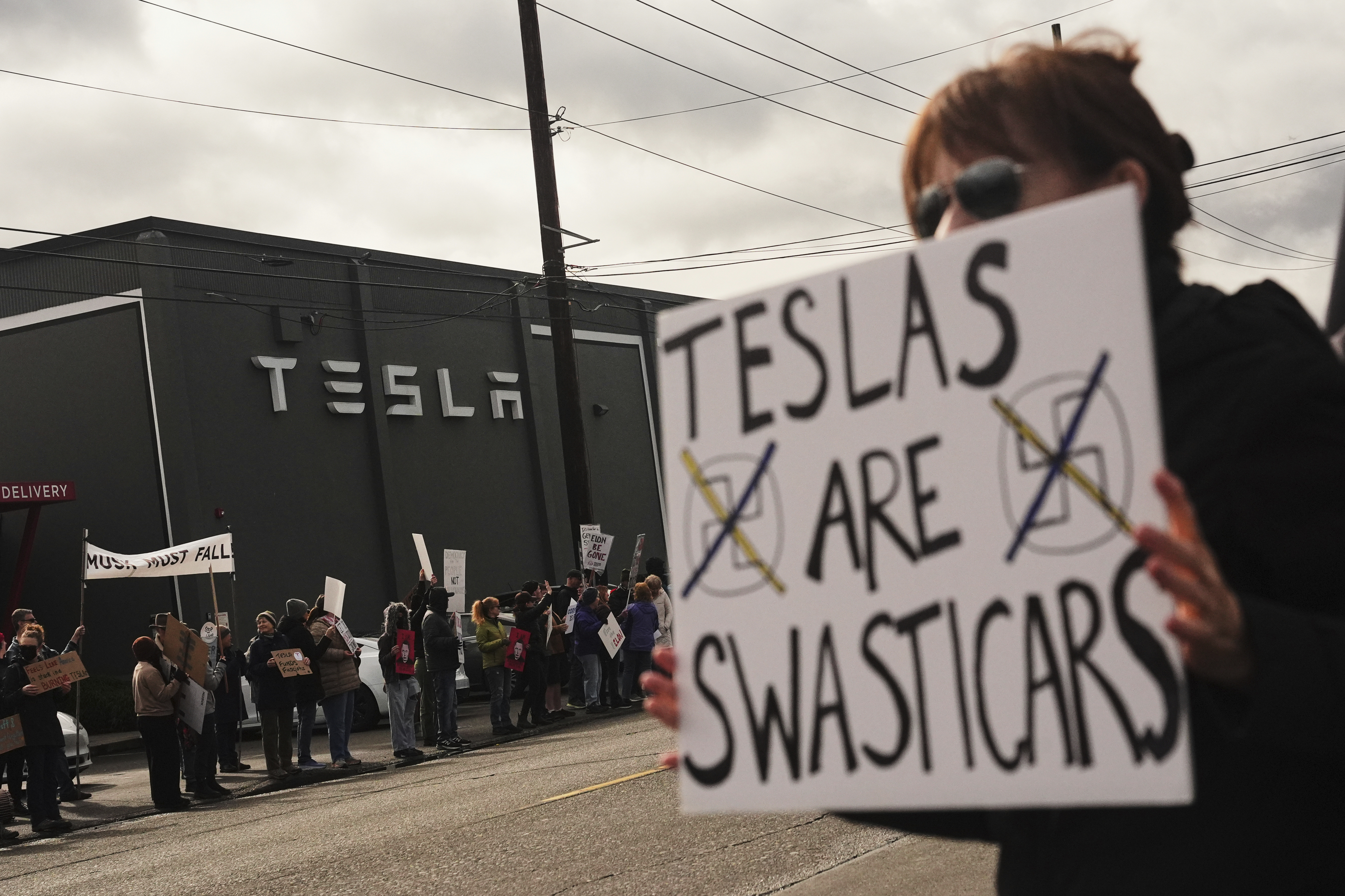 Protesters rebelling against Elon Musk's purge of US government swarm Tesla showrooms