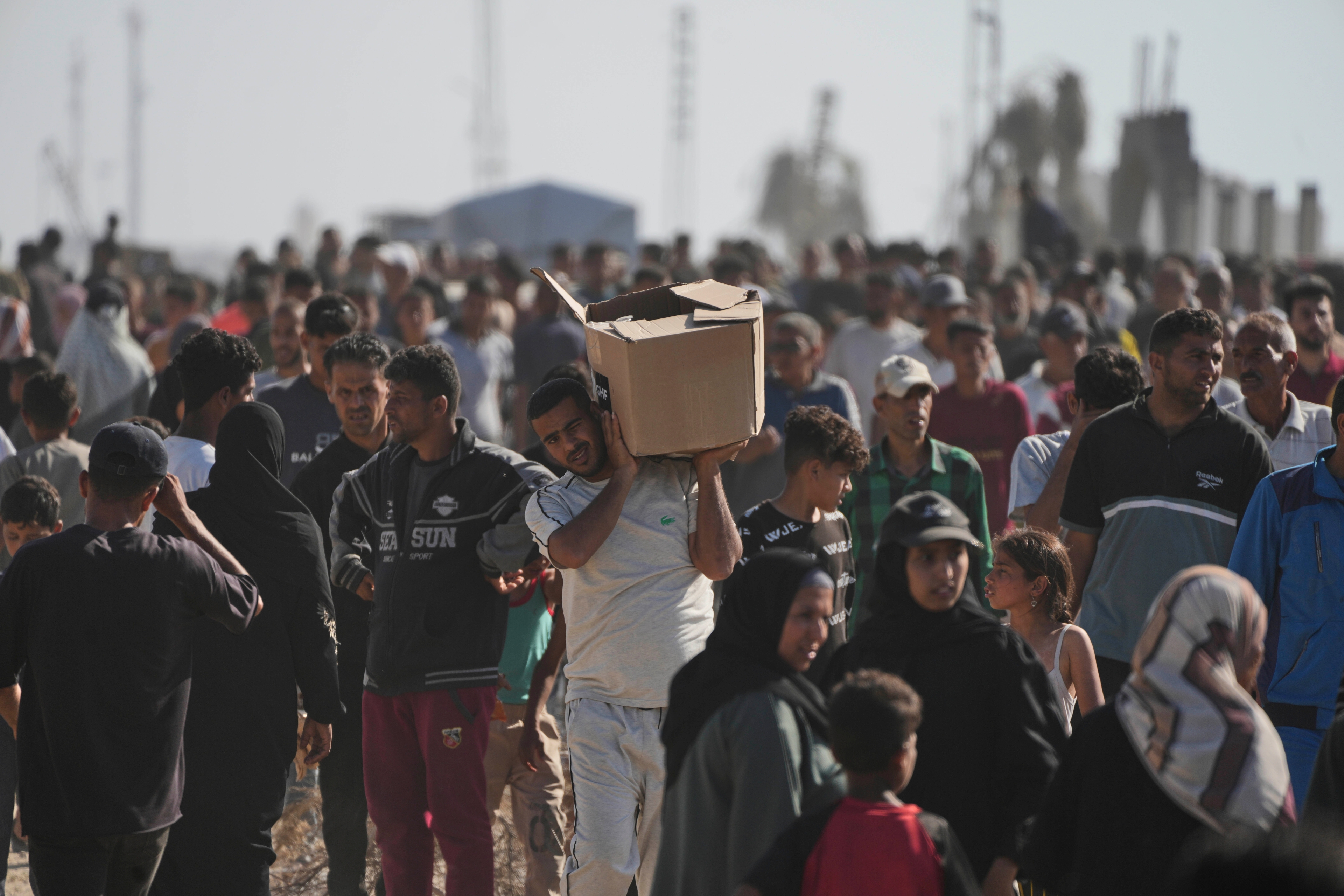 Israeli troops fire warning shots as Palestinians overwhelm new Gaza food center