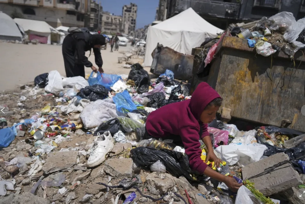 A Family Digs Through Trash for Bits of Food, Showing Gaza's Growing Desperation