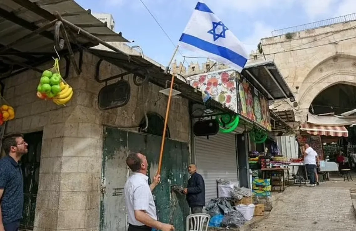 Palestinians Clean up after Israeli Nationalist March in Jerusalem