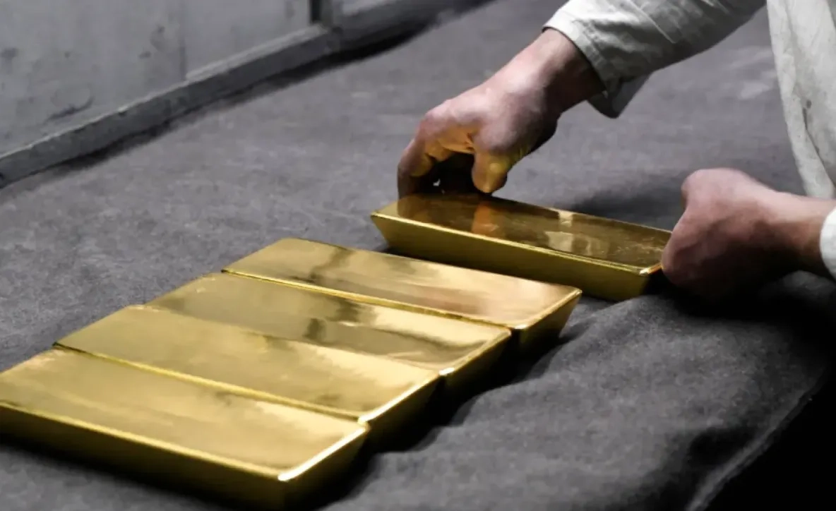 Gold Retreats from Near Four-week High as Dollar Gains; Investors Stay Cautious