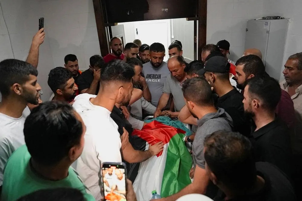 Israeli Settlers Raid West Bank Town, Troops Kill 3 Palestinians