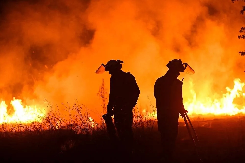 Volunteer Firefighter Dies as Wildfires Rage Across Heat-Stricken Spain
