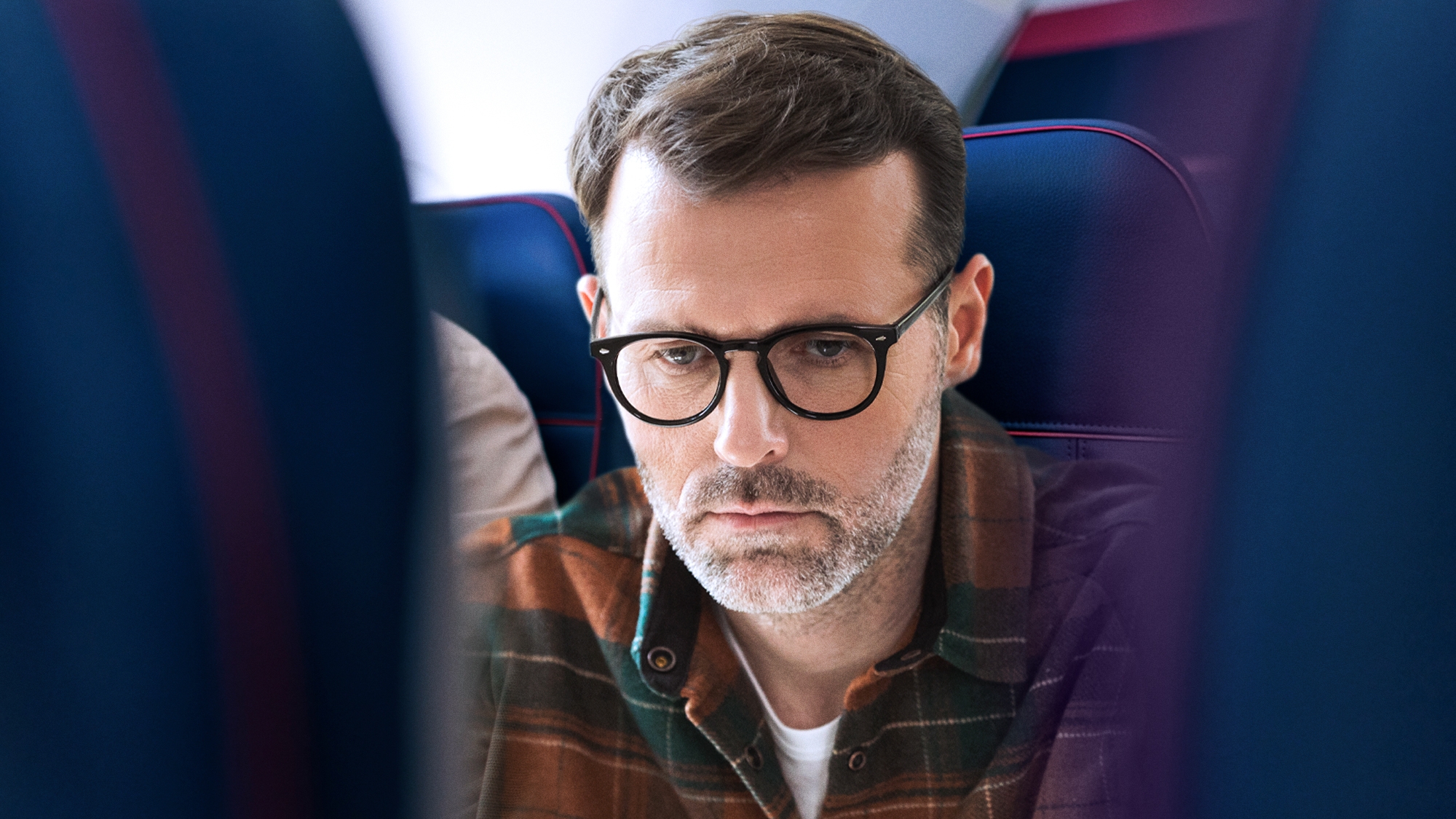 Whole Flight Spent Reading ‘War And Peace' Over Shoulder Of Passenger Ahead