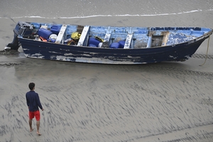5 people charged after migrant boat capsized, killing 3, including 14-year-old boy from India
