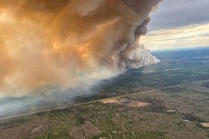 Thousands evacuated from Canada wildfires