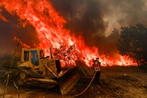 Wildfires fanned by heat wave and strong winds rage across Europe