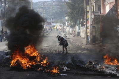 Haiti's government adopts ‘war budget' as town after town falls to gangs