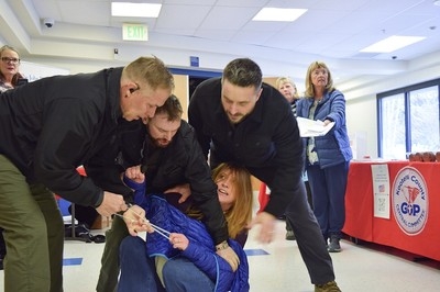 Private security guards charged after woman was dragged out of Idaho town hall meeting