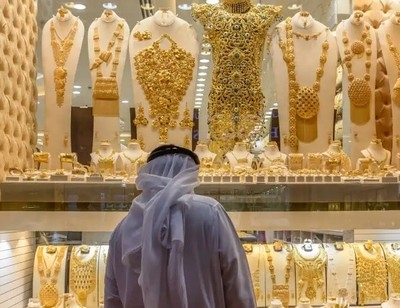 Gold prices climb on safe-haven demand and weaker dollar
