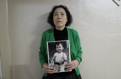 Woman sues South Korea's govt after son was adopted abroad without her consent