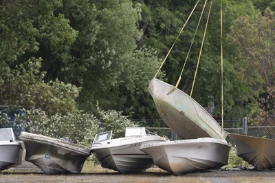 Flying boats make for rare sight as Washington clears island of derelict vessels by helicopter