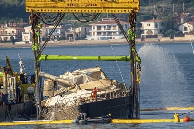 Superyacht pulled from seabed 10 months after sinking off Sicily