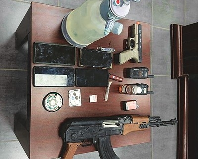 Bedoun Caught Impersonating Cop; Found with Guns and Narcotics
