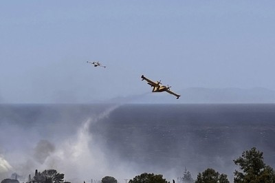 Wildfire prompts evacuations near Athens as summer's first heat wave hits Greece