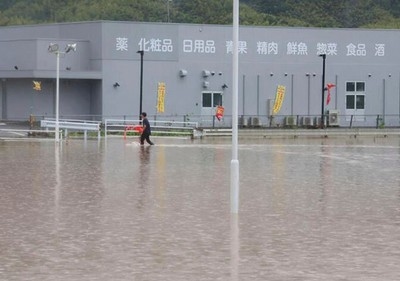 Torrential rains in southern Japan cause flooding, mudslides and travel disruptions
