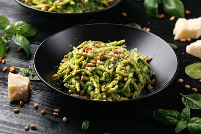 Trofie pasta with creamy spinach sauce and toasted pine nuts