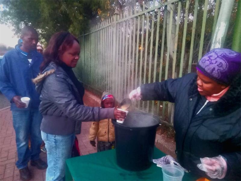 Local organisation's soup kitchen keeps queuing patients warm
