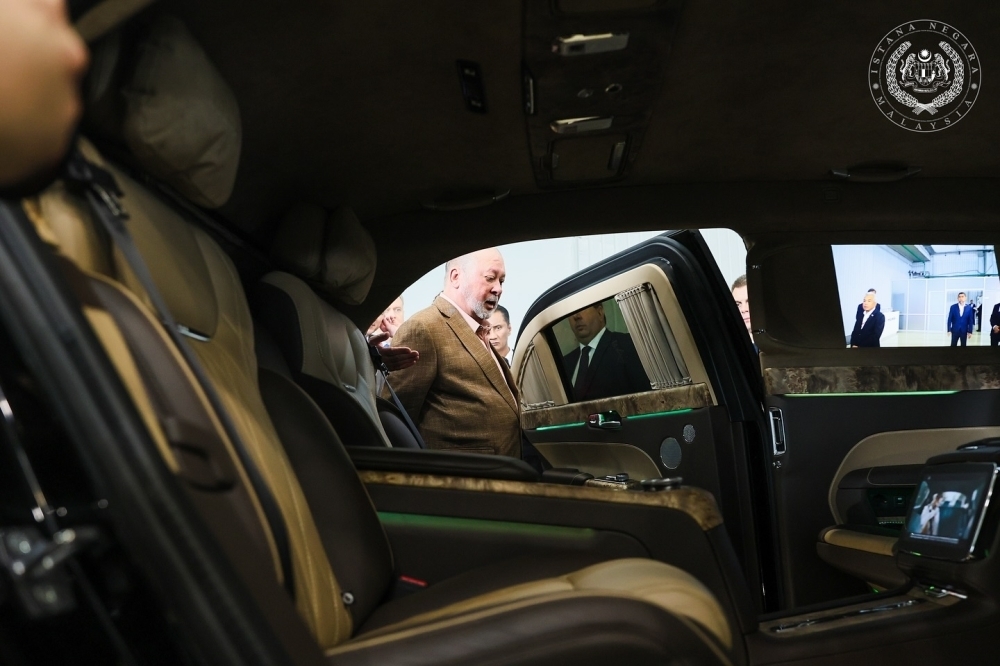 King test drives Russian-made Aurus luxury car during visit to top auto institute in Moscow