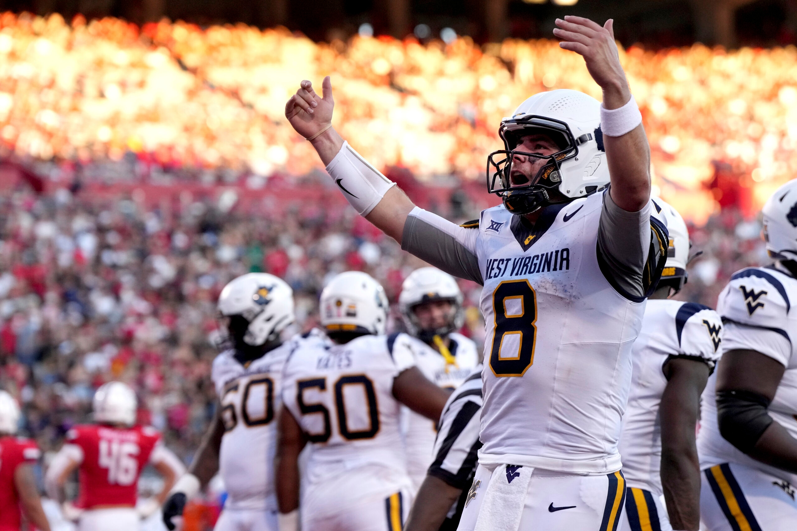 WVU opens camp needing answers at quarterback, defense