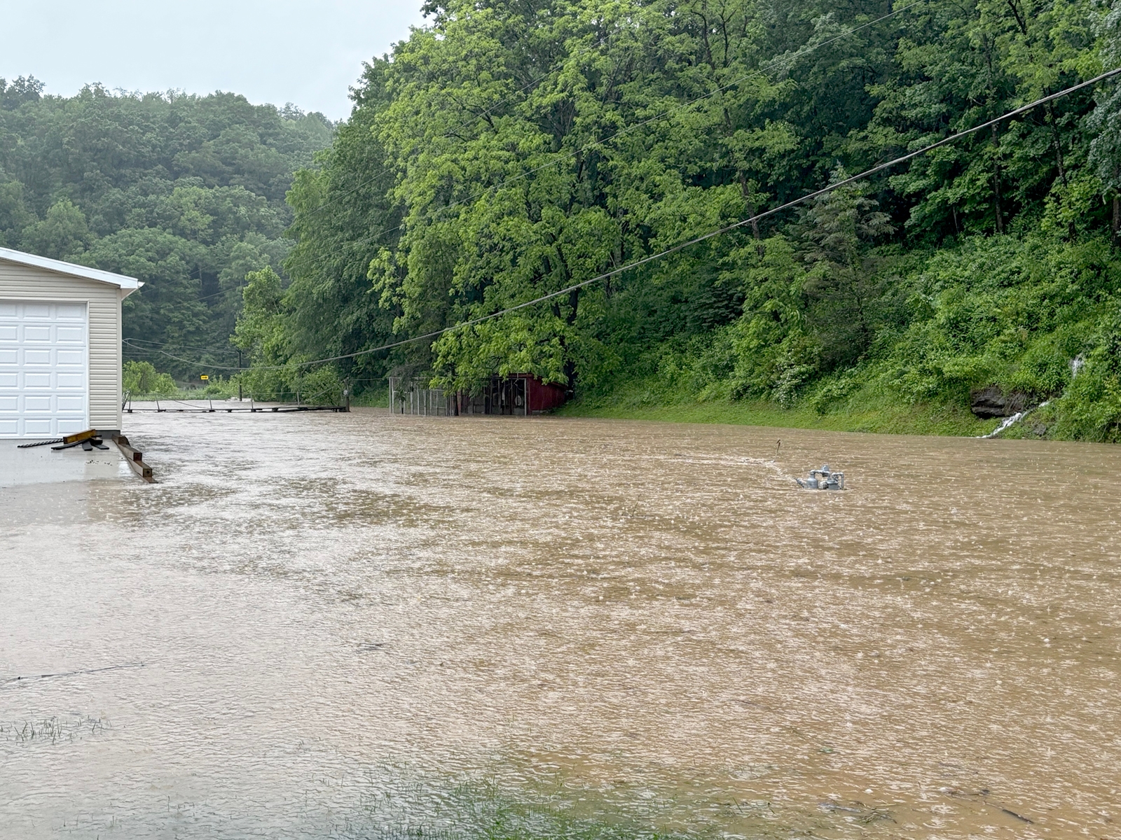 Heavy rain floods creeks, roads and basements