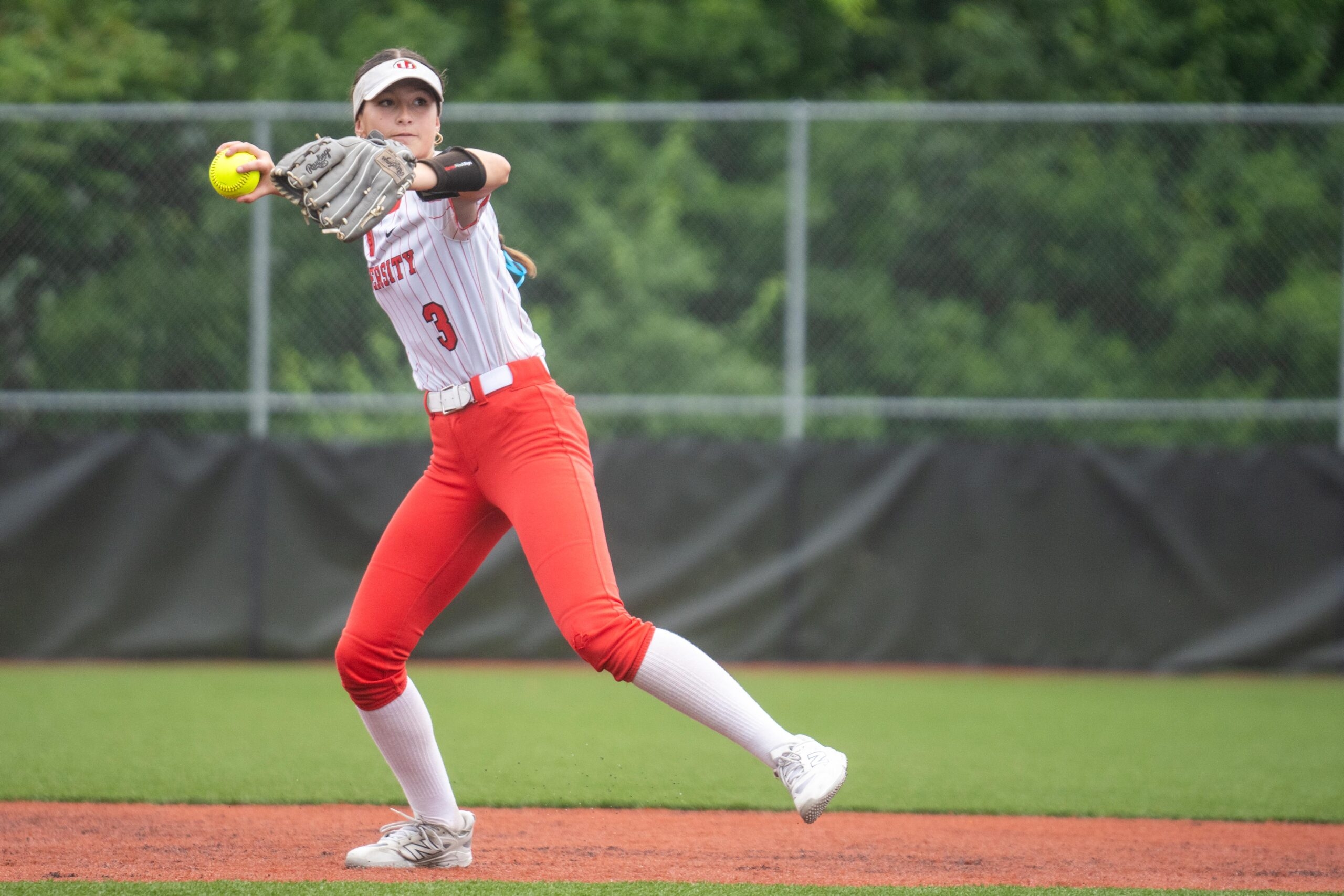 University softball outlasts weather delay, late Jefferson surge for victory in opening game of state tournament