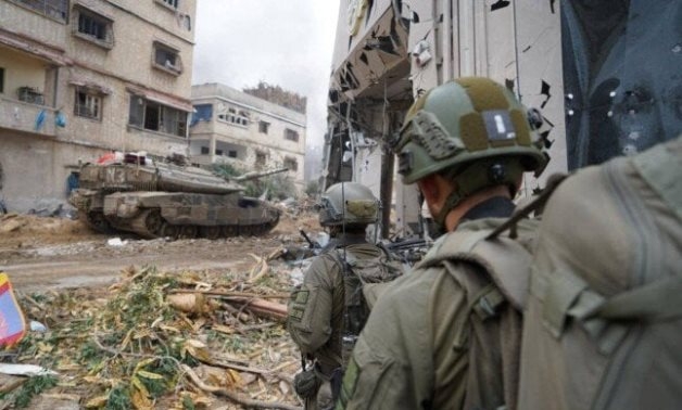Israeli defense minister threatens to seize more Gaza territory unless Hamas frees captives